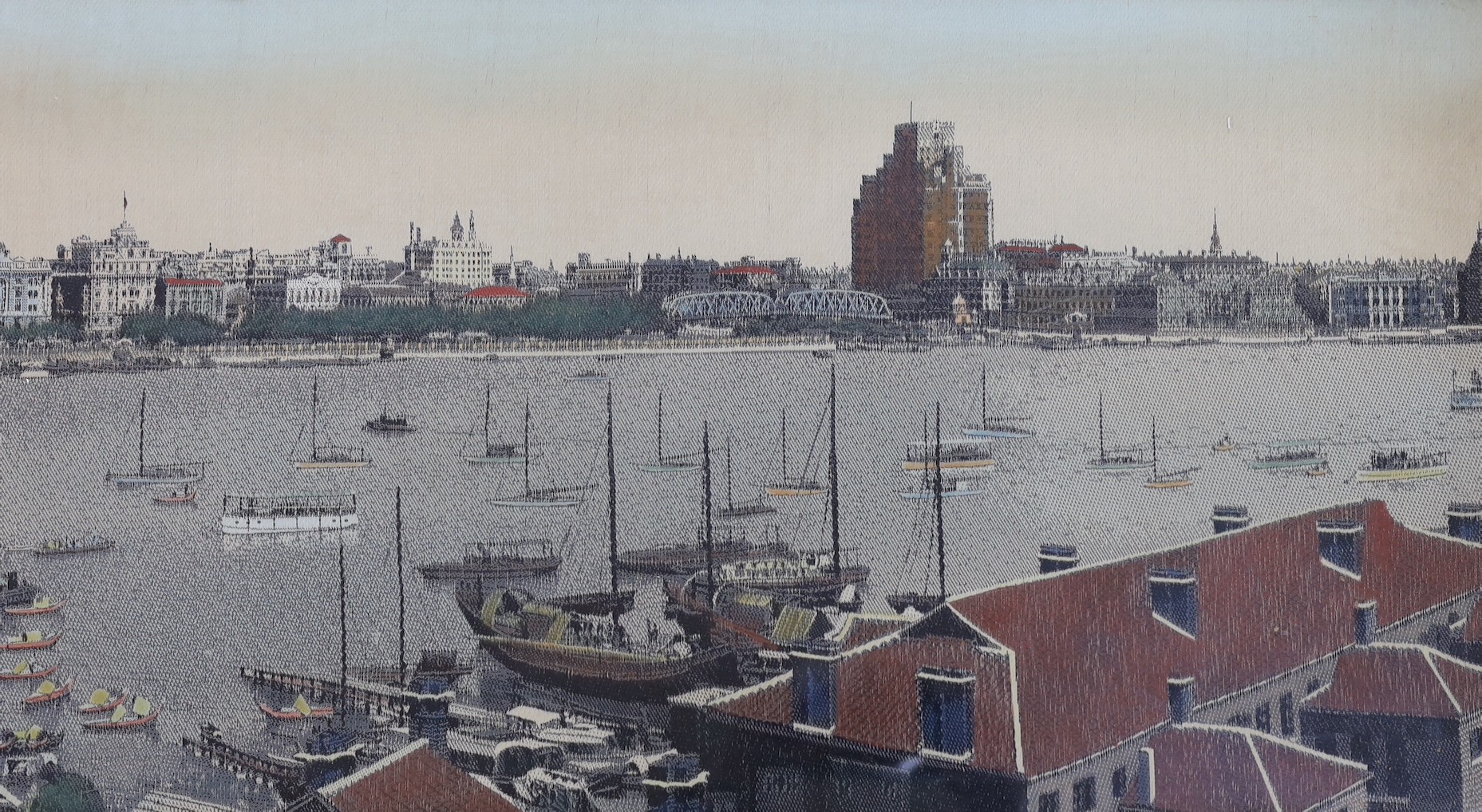 A framed early 20th century Chinese machine woven panorama of Shanghai harbour, 39x165cm excl frame